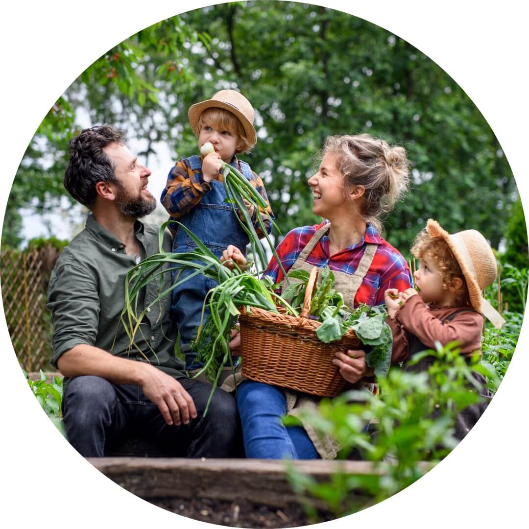 Family laughing and gardening